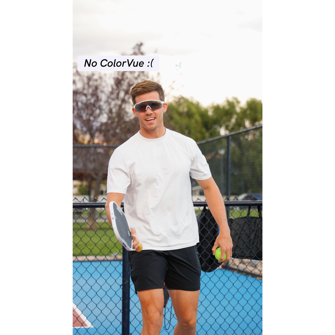 Man holding a paddle and a ball on a pickleball court with 'No ColorVue' text overlay.